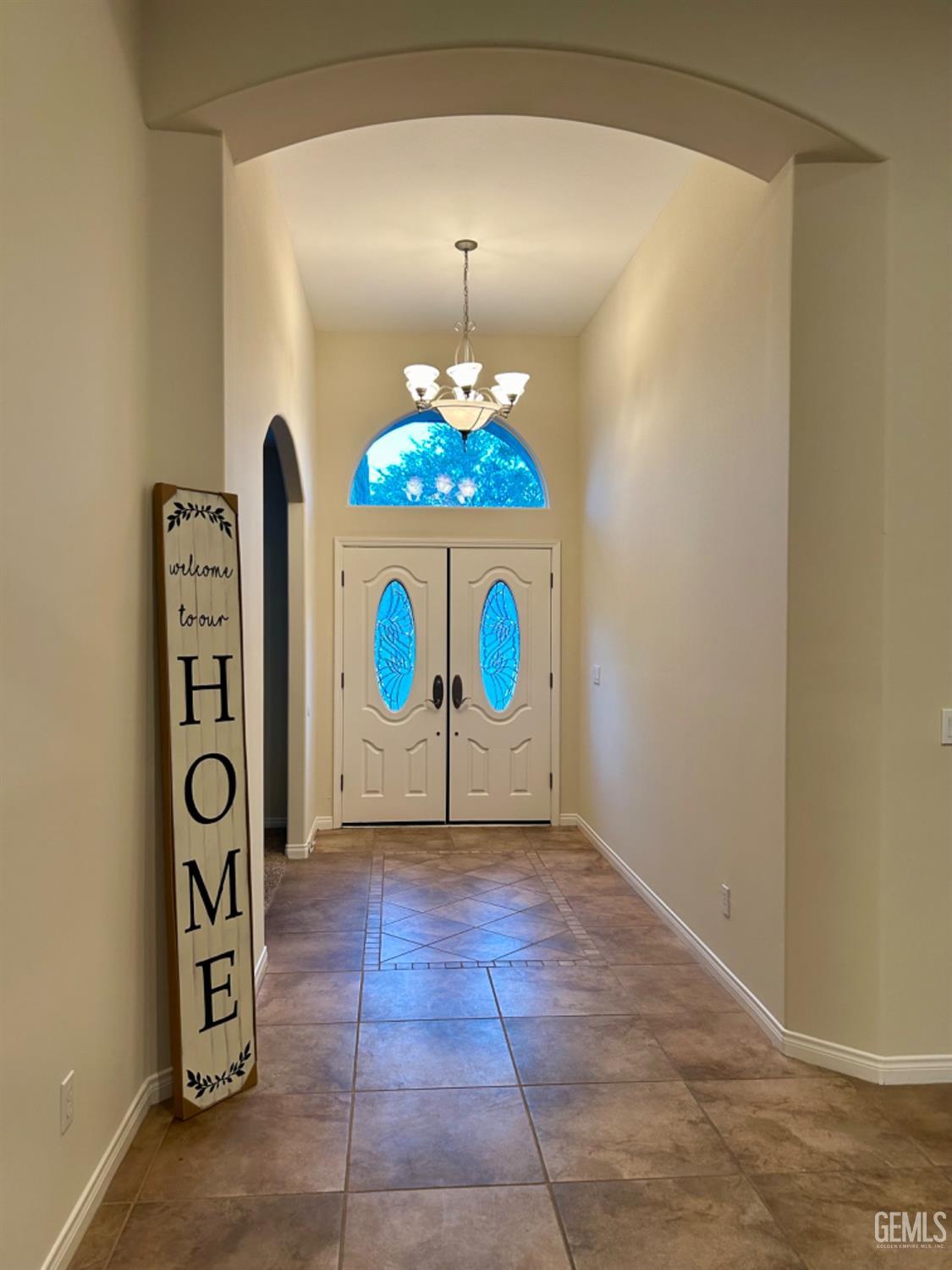 Undisclosed Address Taft, CA 93268 - Photo 12 of 27 a view of an entryway with a chandelier