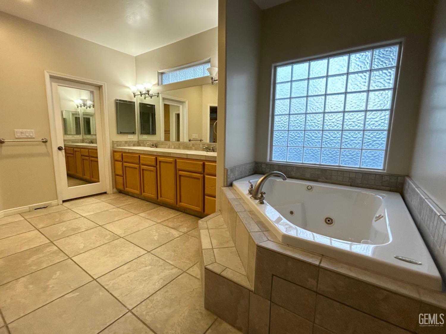 Undisclosed Address Taft, CA 93268 - Photo 17 of 27 a bathroom with a tub a sink and a large window
