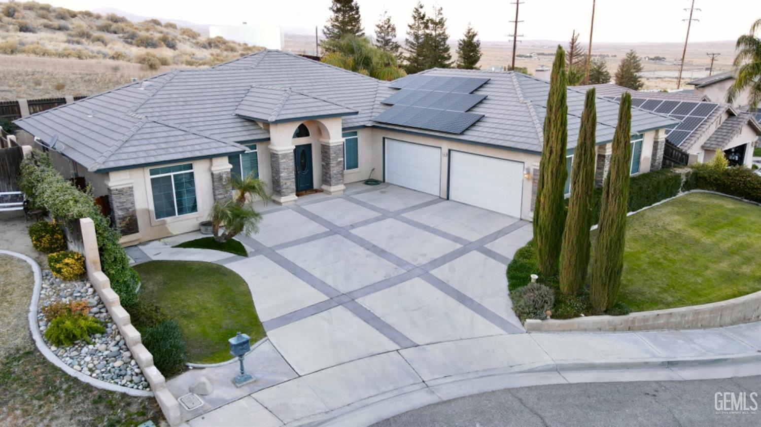 Undisclosed Address Taft, CA 93268 - Photo 2 of 27 a aerial view of a house with garden
