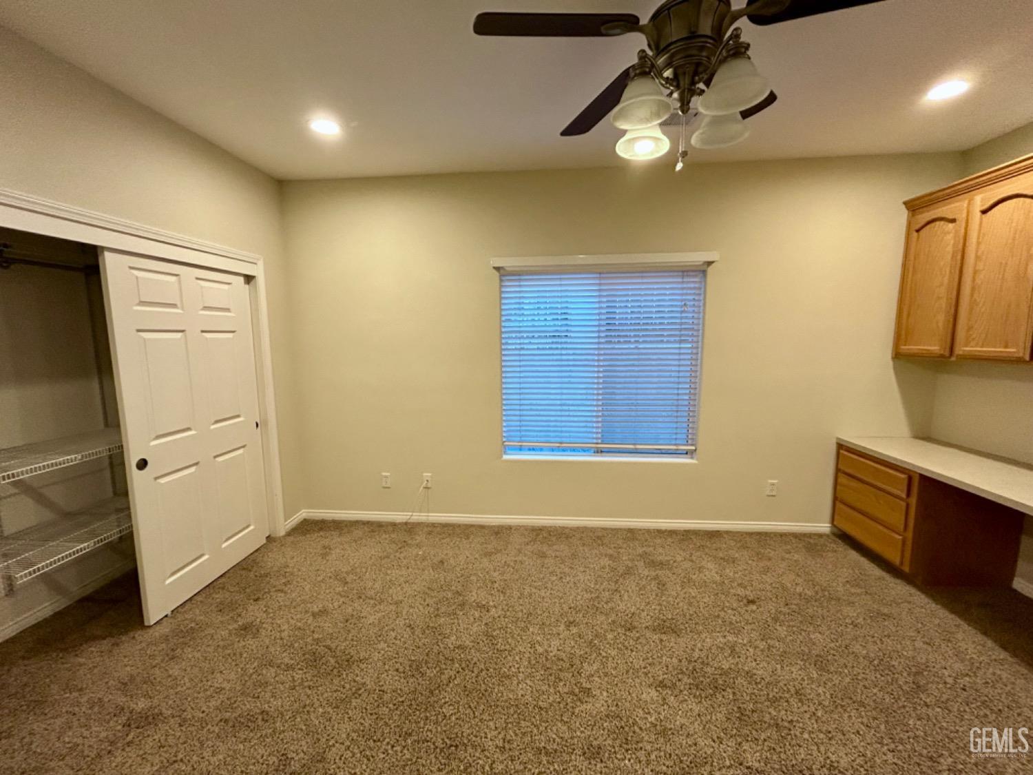 Undisclosed Address Taft, CA 93268 - Photo 21 of 27 a view of an empty room with a kitchen