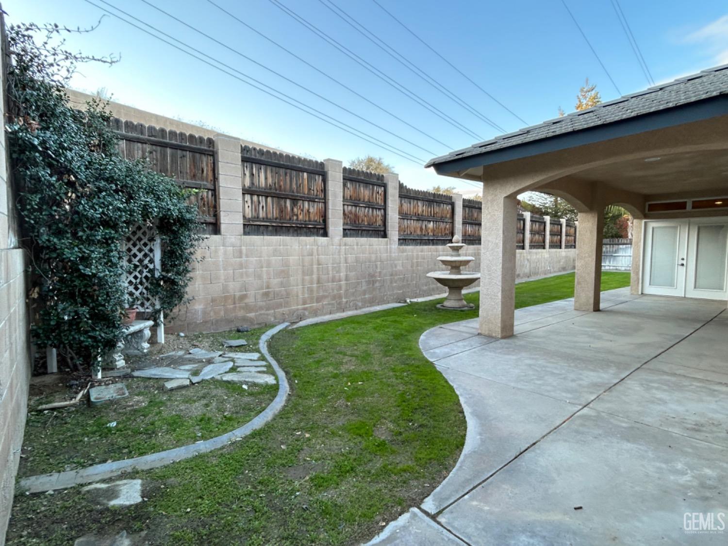 Undisclosed Address Taft, CA 93268 - Photo 3 of 27 a view of house in front of a big yard with potted plants