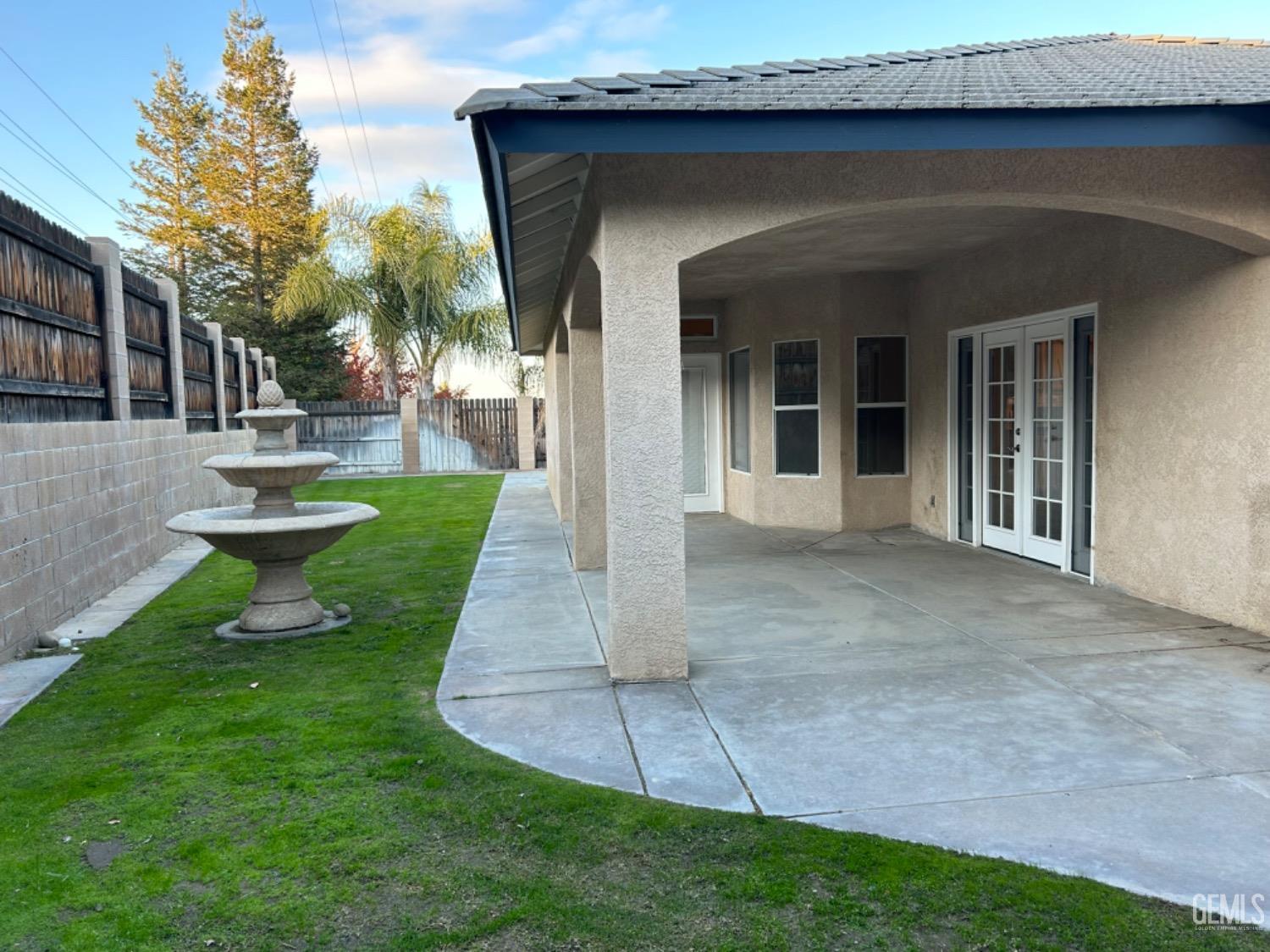Undisclosed Address Taft, CA 93268 - Photo 4 of 27 a view of a house with a yard potted plants and a table