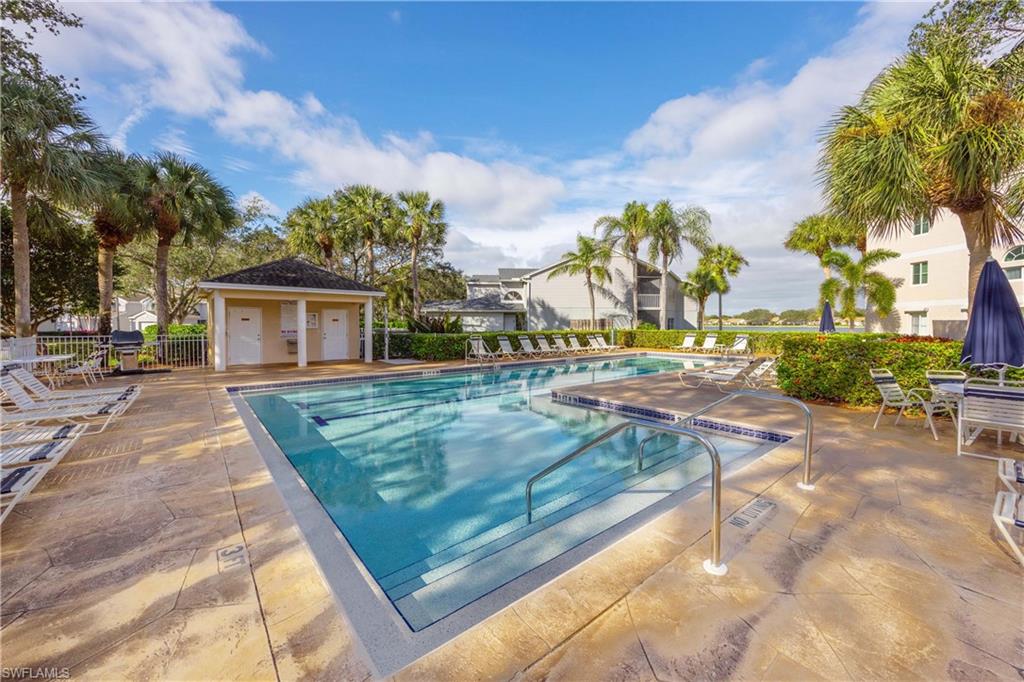 2860 Citrus Lake Drive, Unit R204 Naples, FL 34109 - Photo 27 of 32 View of pool with a patio area
