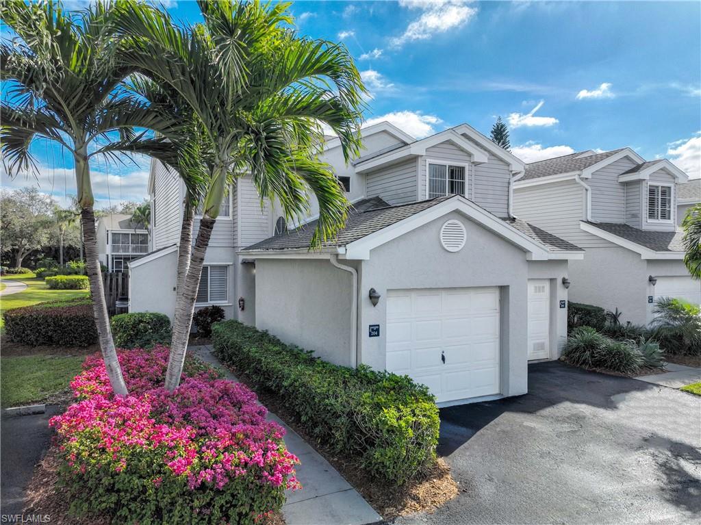 2860 Citrus Lake Drive, Unit R204 Naples, FL 34109 - Photo 29 of 32 View of front of property with a garage
