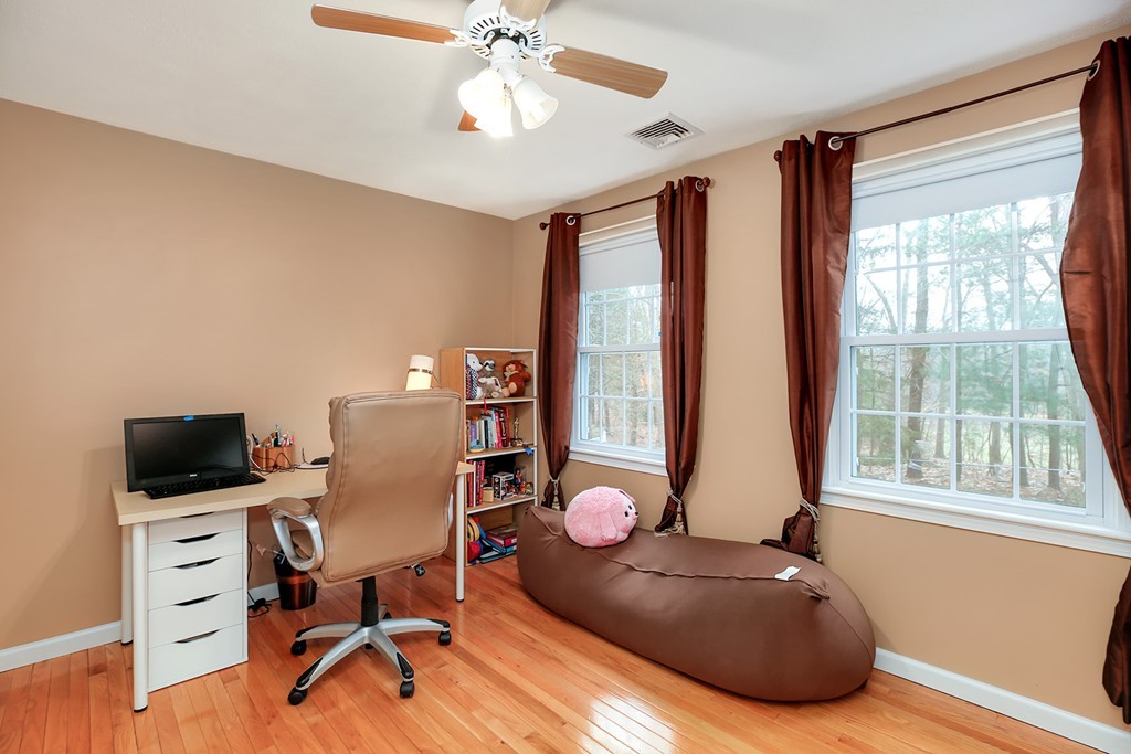830 Worcester Street Wellesley, MA 02482 - Photo 21 of 30 a view of a workspace with furniture and a window