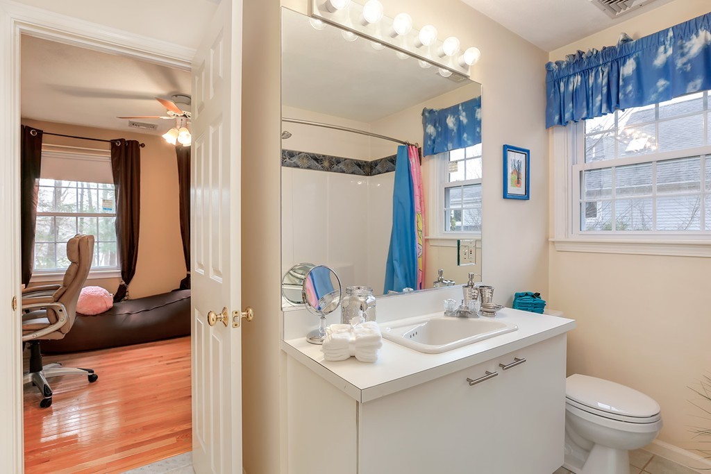 830 Worcester Street Wellesley, MA 02482 - Photo 22 of 30 a bathroom with a sink toilet and shower