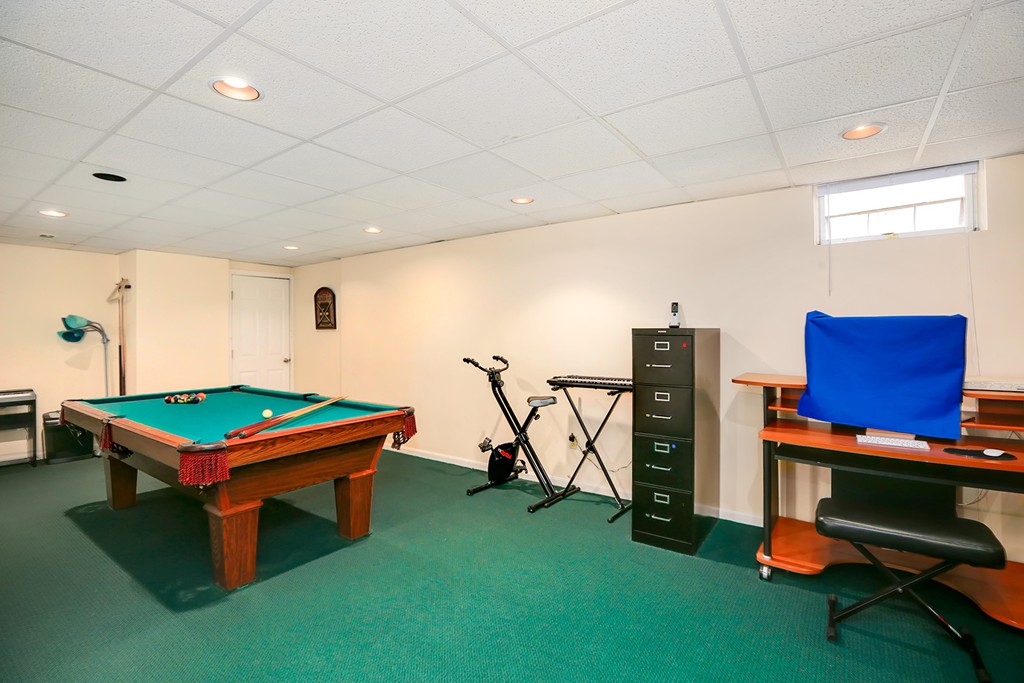 830 Worcester Street Wellesley, MA 02482 - Photo 23 of 30 a room with furniture pool table gym equipment and a rug