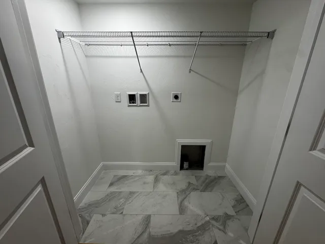 a view of an empty room with windows