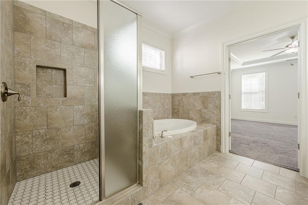 1040 Peyton View Court Alpharetta, GA 30004 - Photo 15 of 53 a bathroom with a granite countertop bathtub shower and toilet