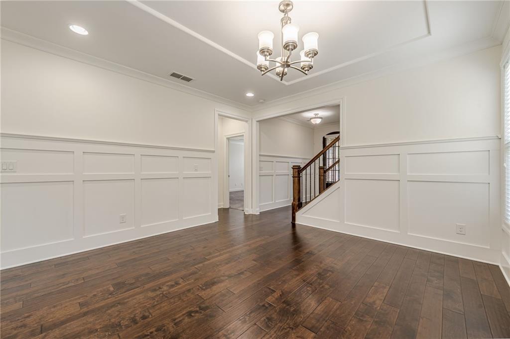 1040 Peyton View Court Alpharetta, GA 30004 - Photo 17 of 53 wooden floor in an empty room with a window
