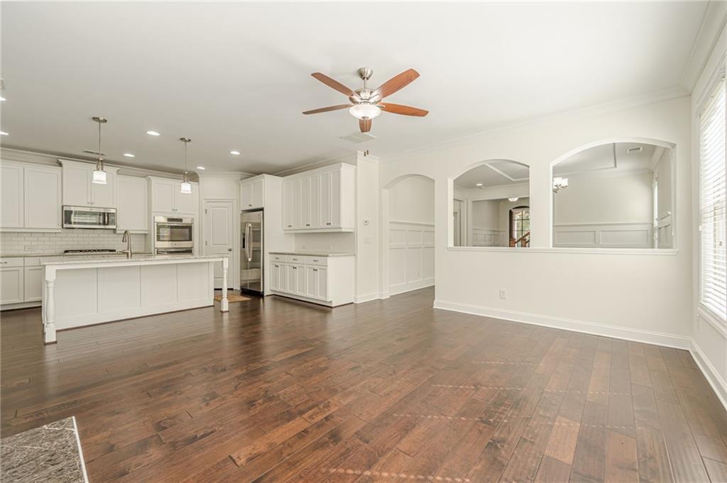 1040 Peyton View Court Alpharetta, GA 30004 - Photo 21 of 53 a view of a kitchen with wooden floor and a kitchen