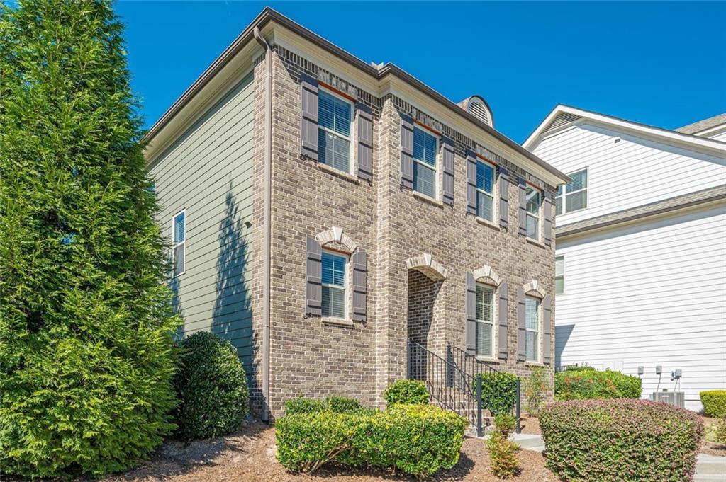 1040 Peyton View Court Alpharetta, GA 30004 - Photo 3 of 53 a front view of a house with a yard