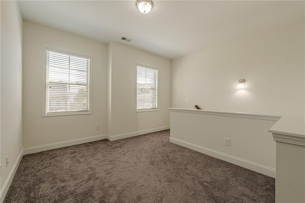 1040 Peyton View Court Alpharetta, GA 30004 - Photo 32 of 53 an empty room with windows