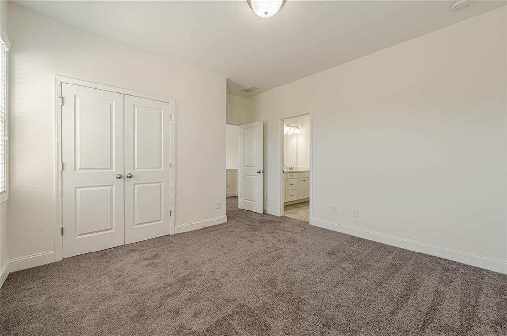 1040 Peyton View Court Alpharetta, GA 30004 - Photo 34 of 53 an empty room with an entryway