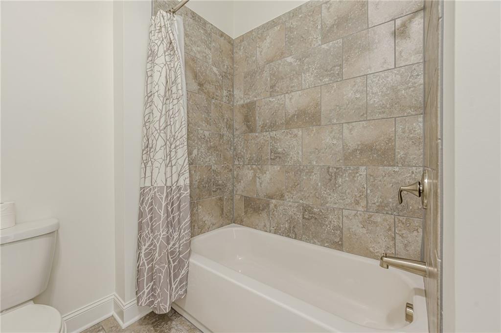 1040 Peyton View Court Alpharetta, GA 30004 - Photo 37 of 53 a bathroom with a bathtub and shower