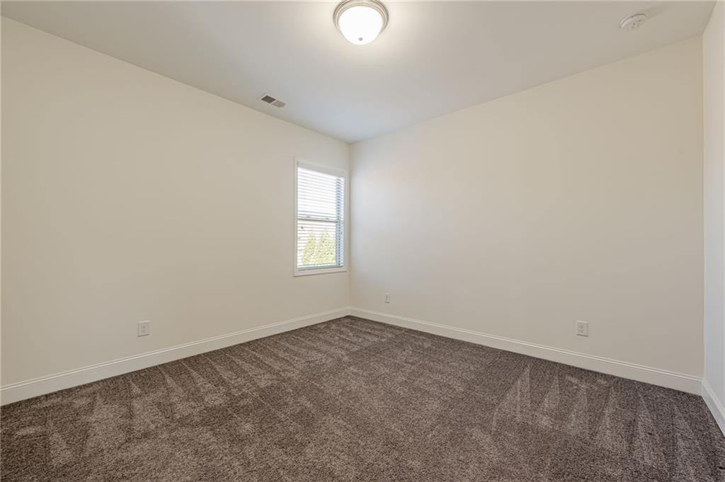 1040 Peyton View Court Alpharetta, GA 30004 - Photo 38 of 53 an empty room with windows