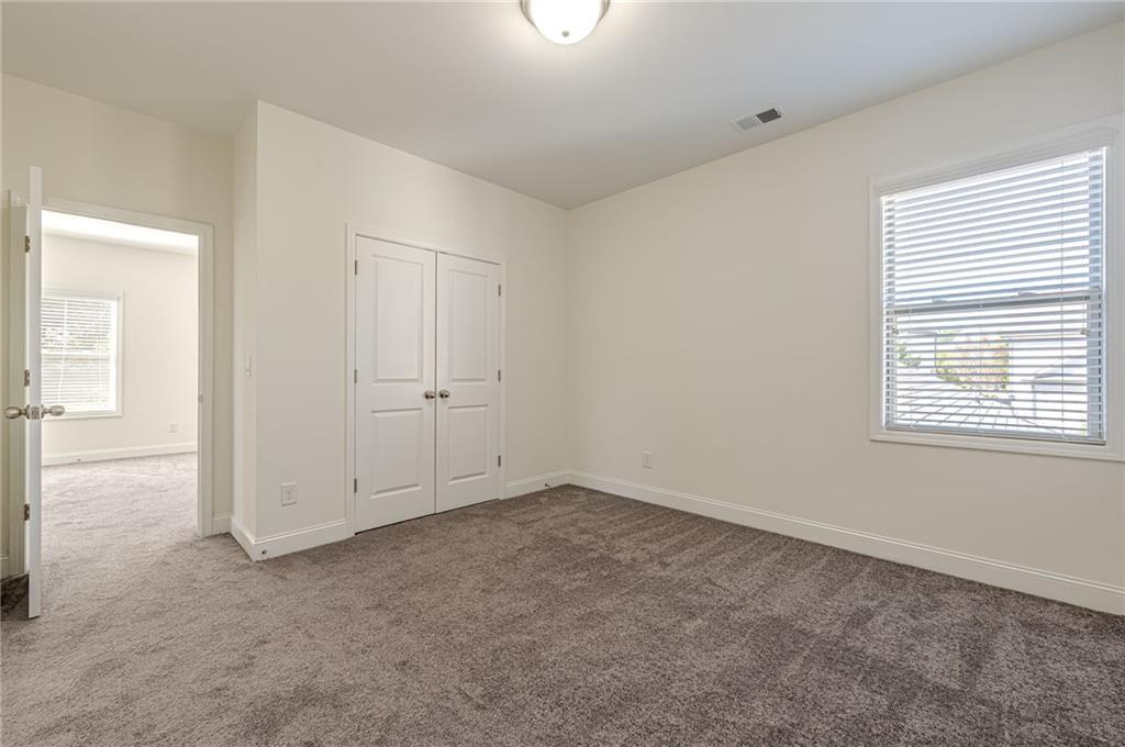 1040 Peyton View Court Alpharetta, GA 30004 - Photo 40 of 53 an empty room with windows