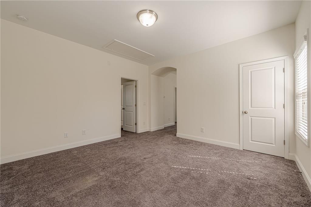 1040 Peyton View Court Alpharetta, GA 30004 - Photo 42 of 53 an empty room with an entryway