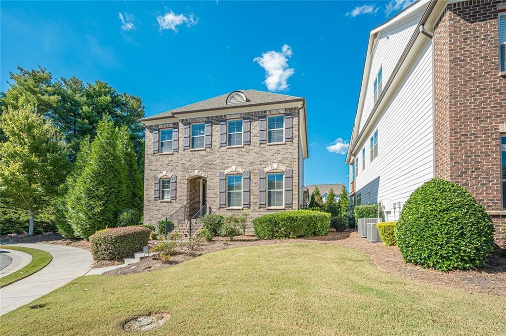 1040 Peyton View Court Alpharetta, GA 30004 - Photo 5 of 53 a front view of a house with a yard