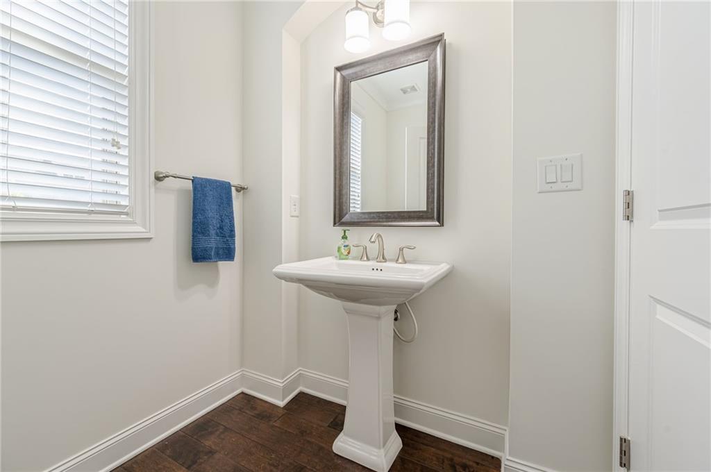 1040 Peyton View Court Alpharetta, GA 30004 - Photo 10 of 53 a bathroom with a sink and a mirror