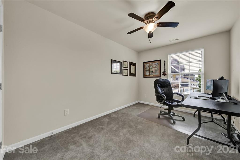 107 Inlet Point Drive Tega Cay, SC 29708 - Photo 17 of 24 a view of a workspace with a window