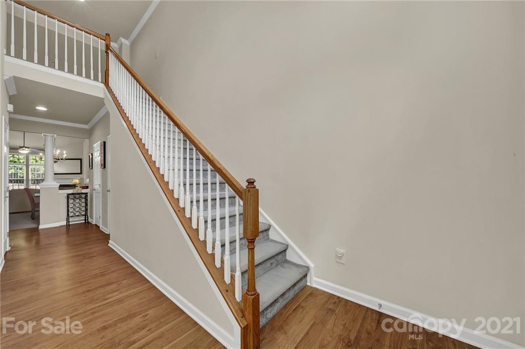 107 Inlet Point Drive Tega Cay, SC 29708 - Photo 3 of 24 a view of entryway and hall with wooden floor