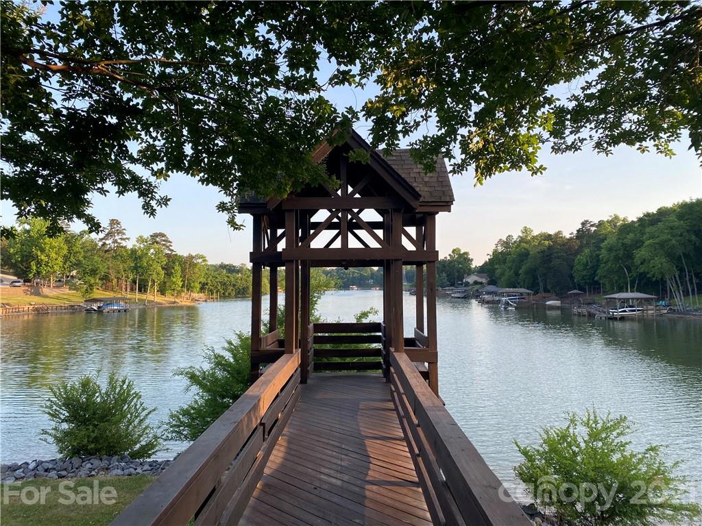 107 Inlet Point Drive Tega Cay, SC 29708 - Photo 23 of 24 a lake view with a wooden floor and lake view