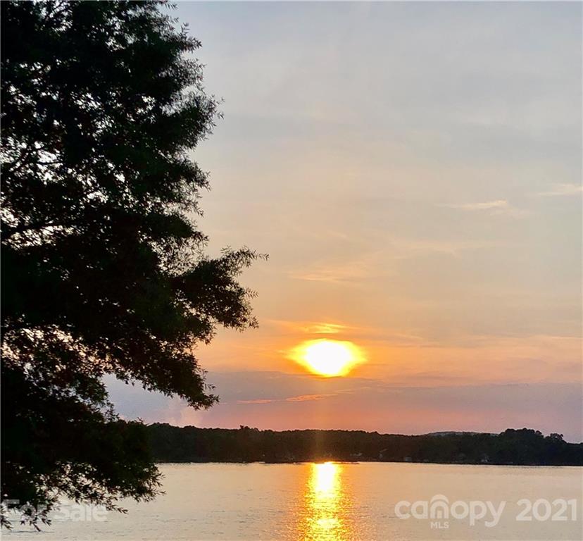 107 Inlet Point Drive Tega Cay, SC 29708 - Photo 24 of 24 a view of lake with sunset