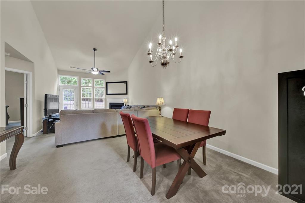 107 Inlet Point Drive Tega Cay, SC 29708 - Photo 7 of 24 a view of a dining room with furniture