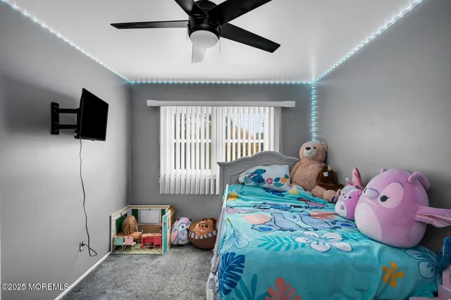 a bedroom with furniture and a window