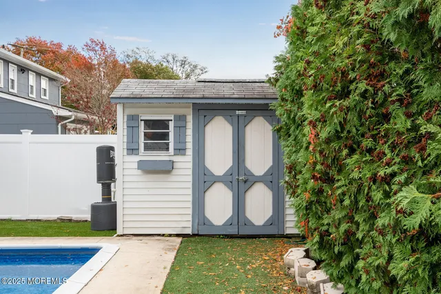 a close up of a sink and a dishwasher in a backyard
