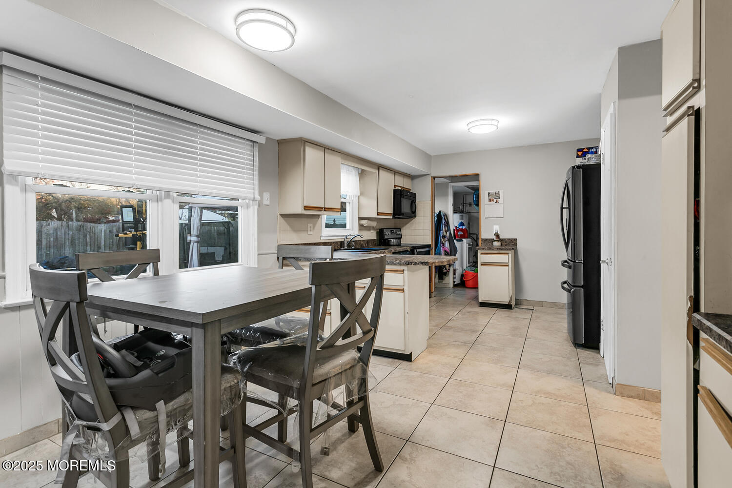3 Lisa Drive Hazlet, NJ 07730 - Photo 10 of 30 a kitchen with stainless steel appliances kitchen island granite countertop a refrigerator a stove a sink a dining table and chairs