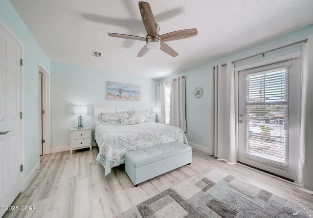 a spacious bedroom with a bed and a window