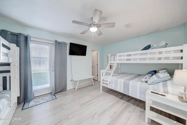 a bed room with a bed and a television