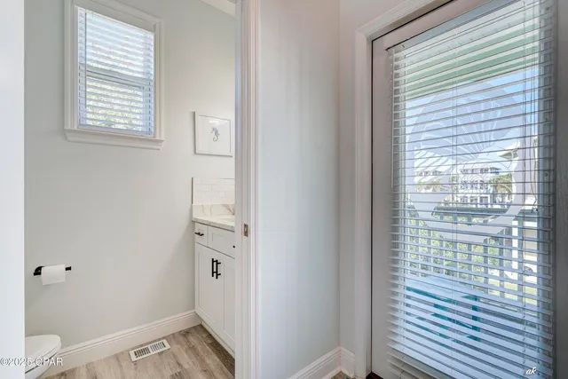 a view of a hallway with windows