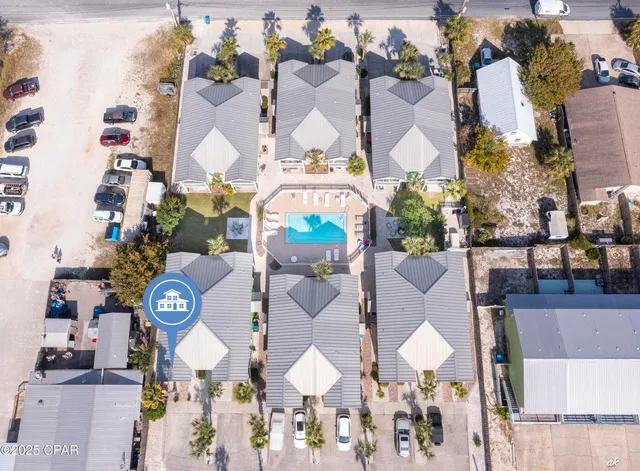 an aerial view of residential house with outdoor space and parking