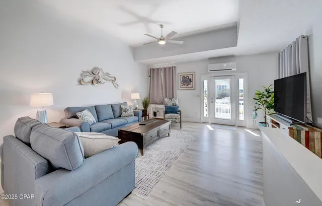 a living room with furniture and a flat screen tv