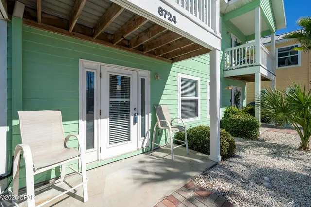 a porch with seating space and a garden
