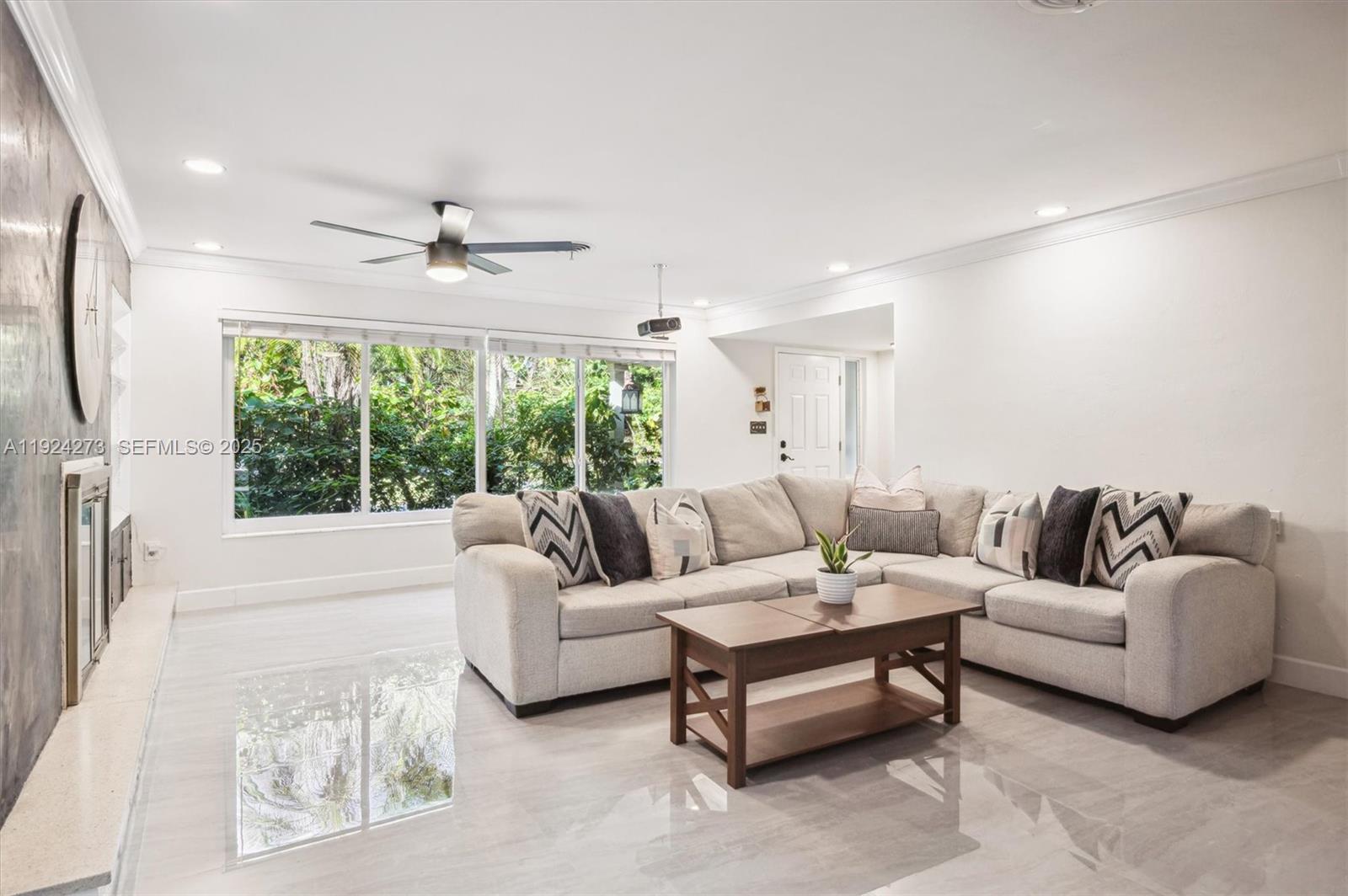 4316 Southwest 6th Street Plantation, FL 33317 - Photo 1 of 24 a living room with furniture and a large window