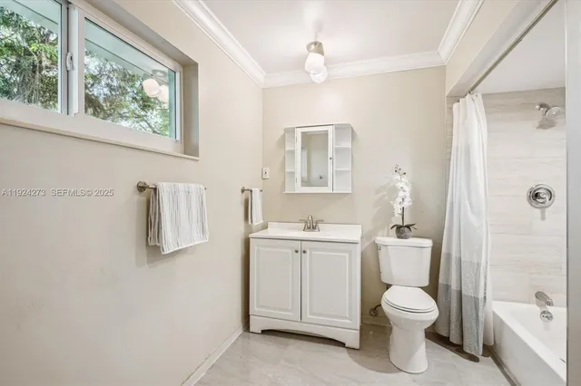 a bedroom with a large bed and a large window