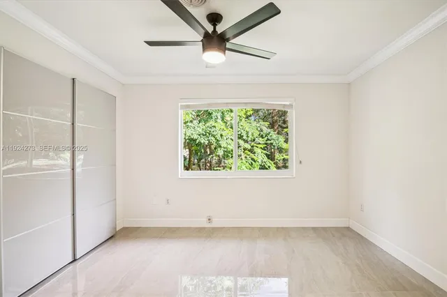 a view of a livingroom with workspace and a window