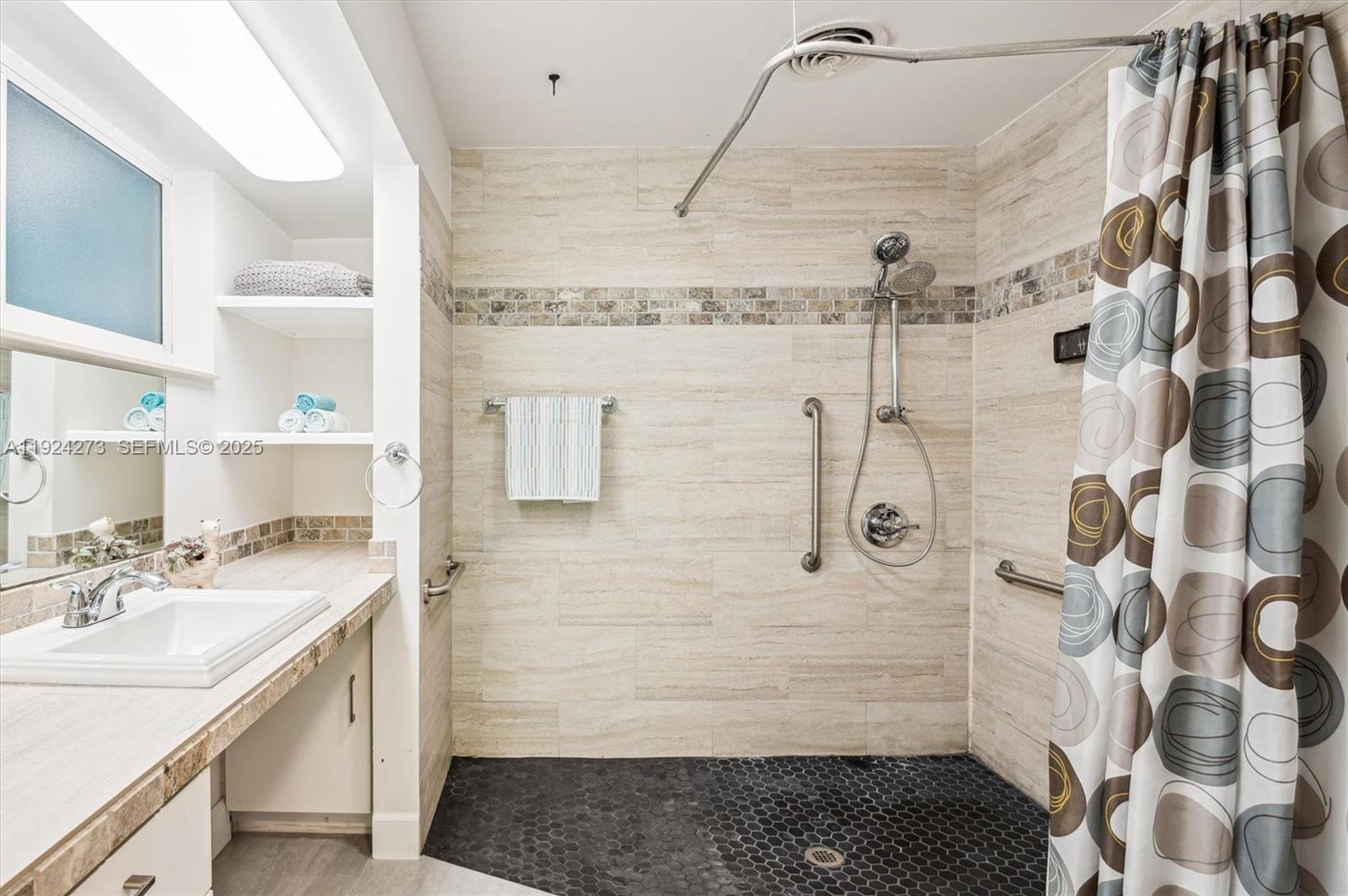 4316 Southwest 6th Street Plantation, FL 33317 - Photo 15 of 24 a bathroom with a sink and a shower