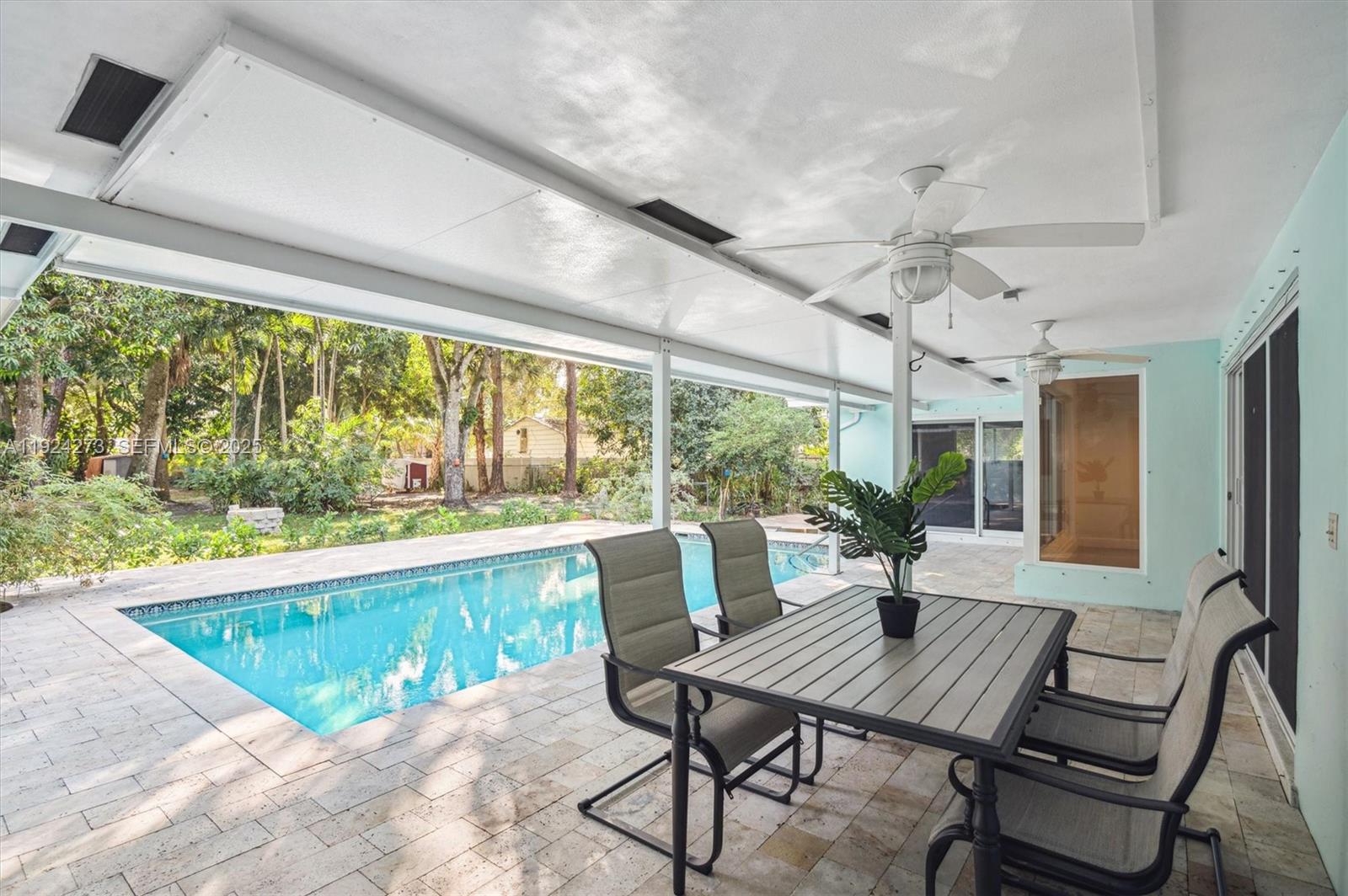 4316 Southwest 6th Street Plantation, FL 33317 - Photo 16 of 24 a view of a dining room with furniture window and outside view