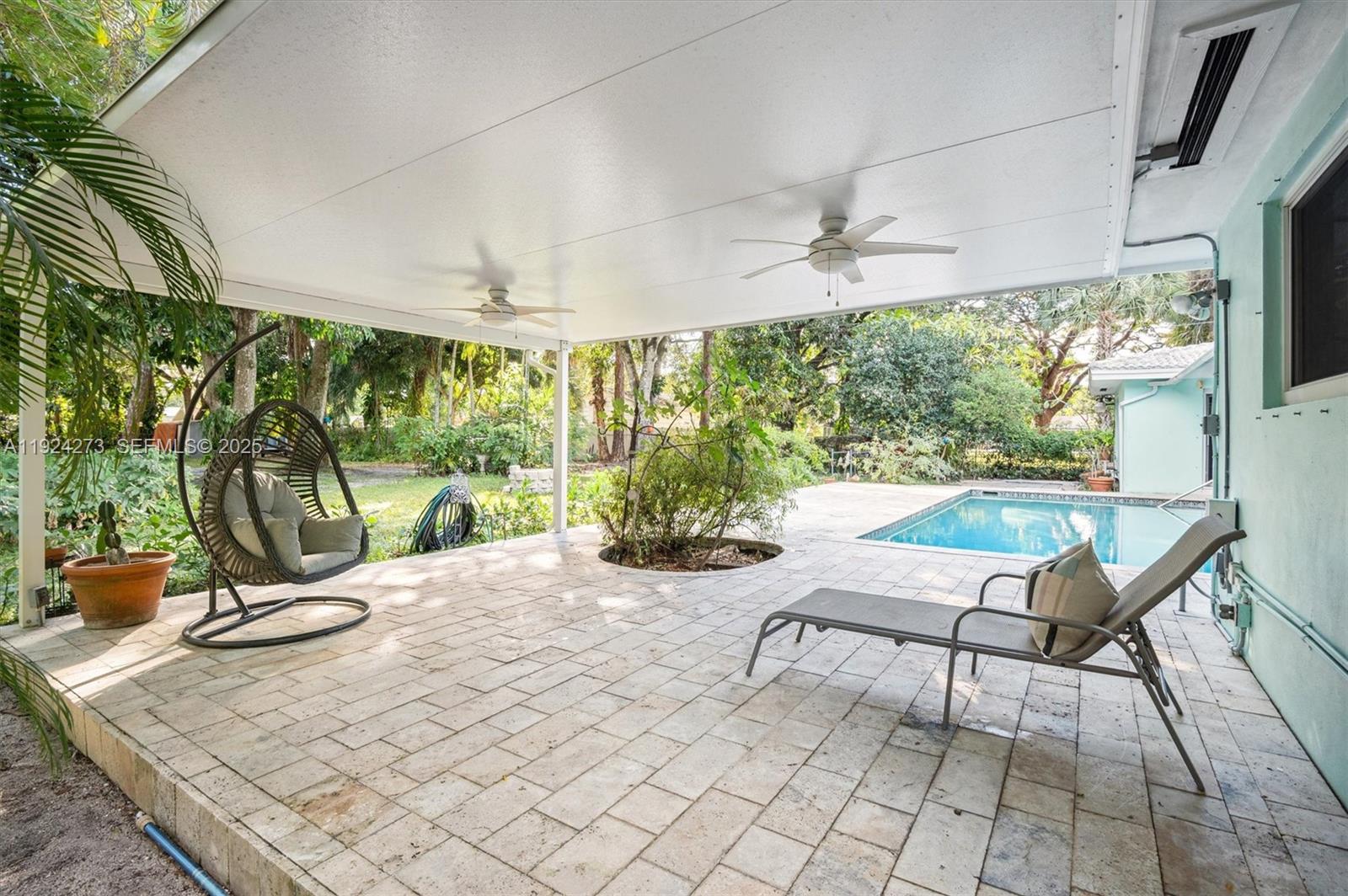 4316 Southwest 6th Street Plantation, FL 33317 - Photo 17 of 24 a view of a chairs and table in patio