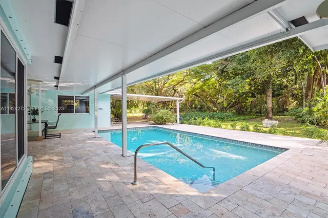 a view of a house with a yard and garage