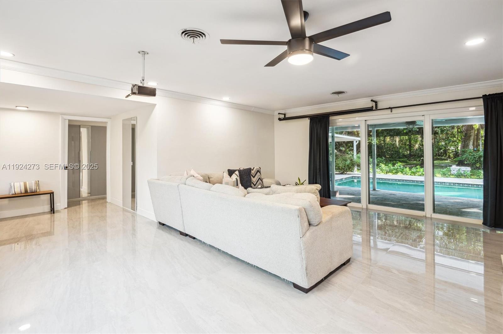 4316 Southwest 6th Street Plantation, FL 33317 - Photo 7 of 24 a living room with furniture and a large window
