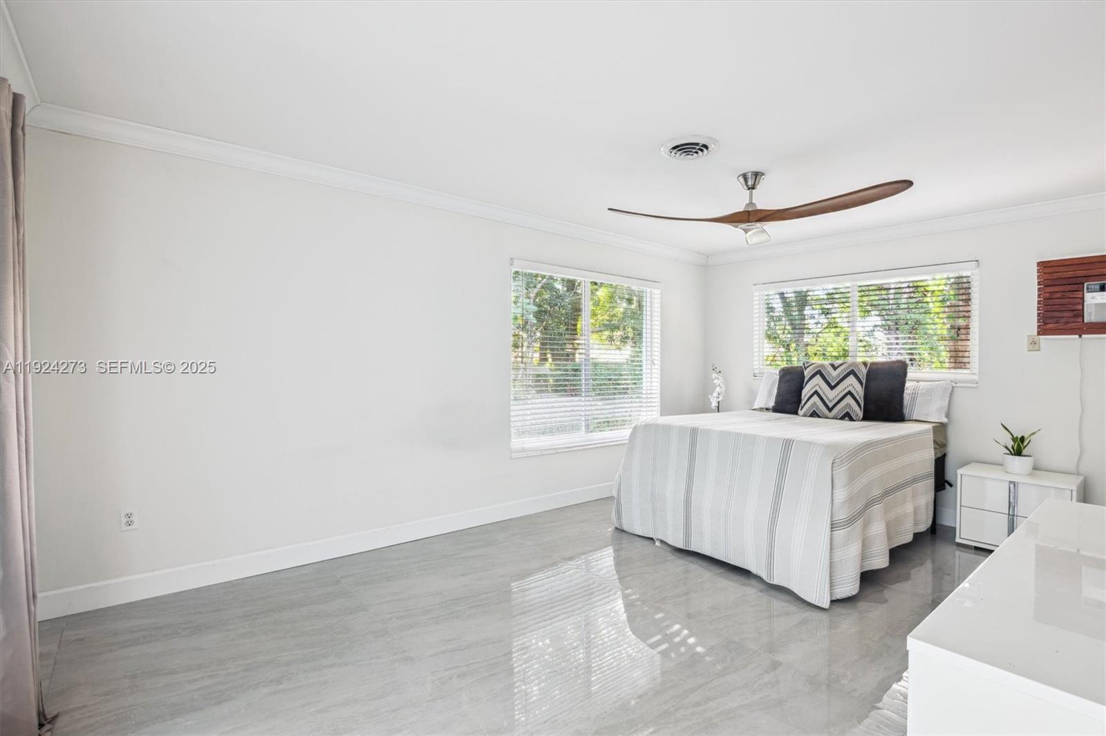 4316 Southwest 6th Street Plantation, FL 33317 - Photo 10 of 24 a bed room with a bed and a large window