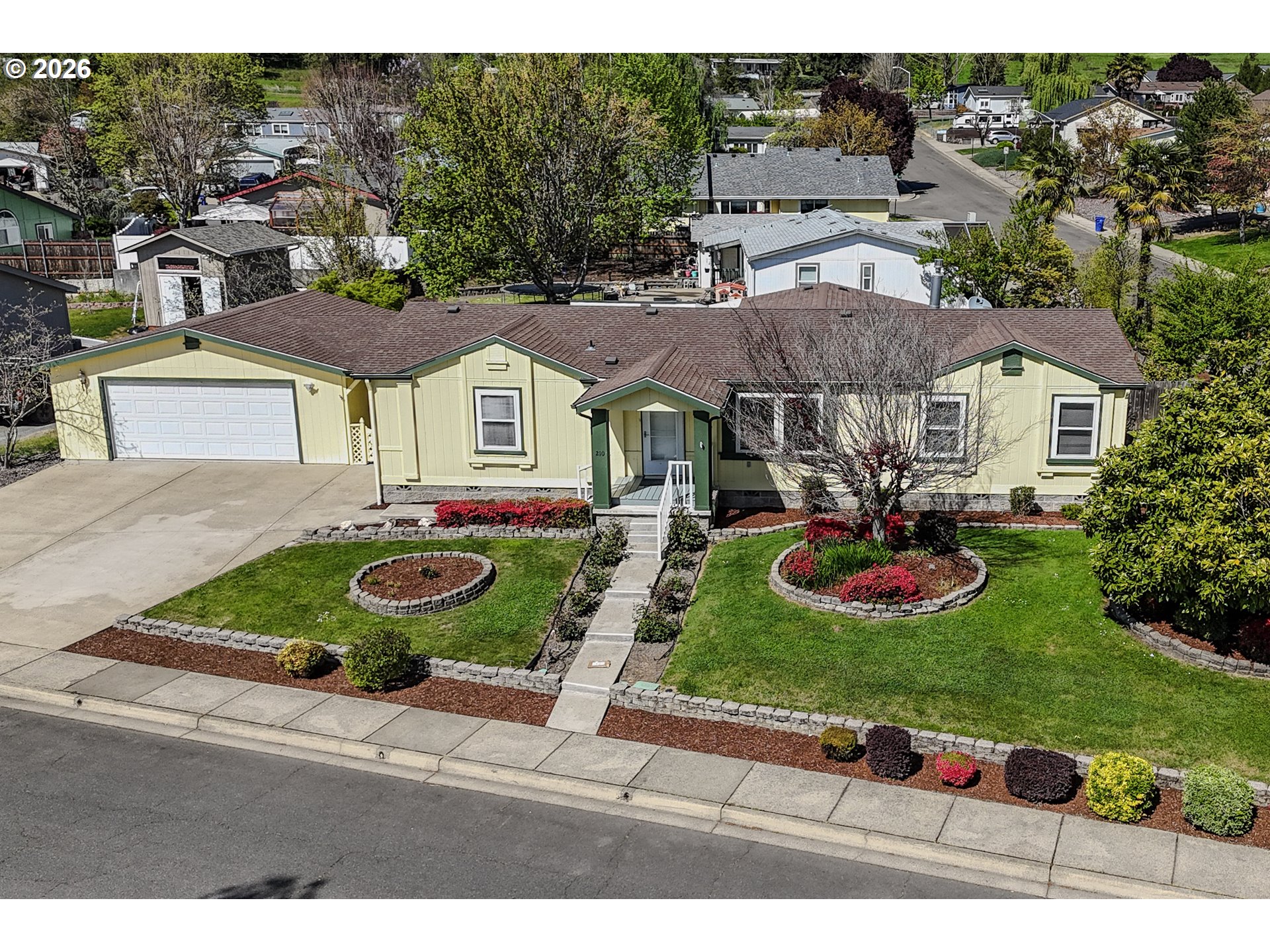 210 Northwest Timothy Avenue Winston, OR 97496 - Photo 1 of 48 a front view of a house with garden