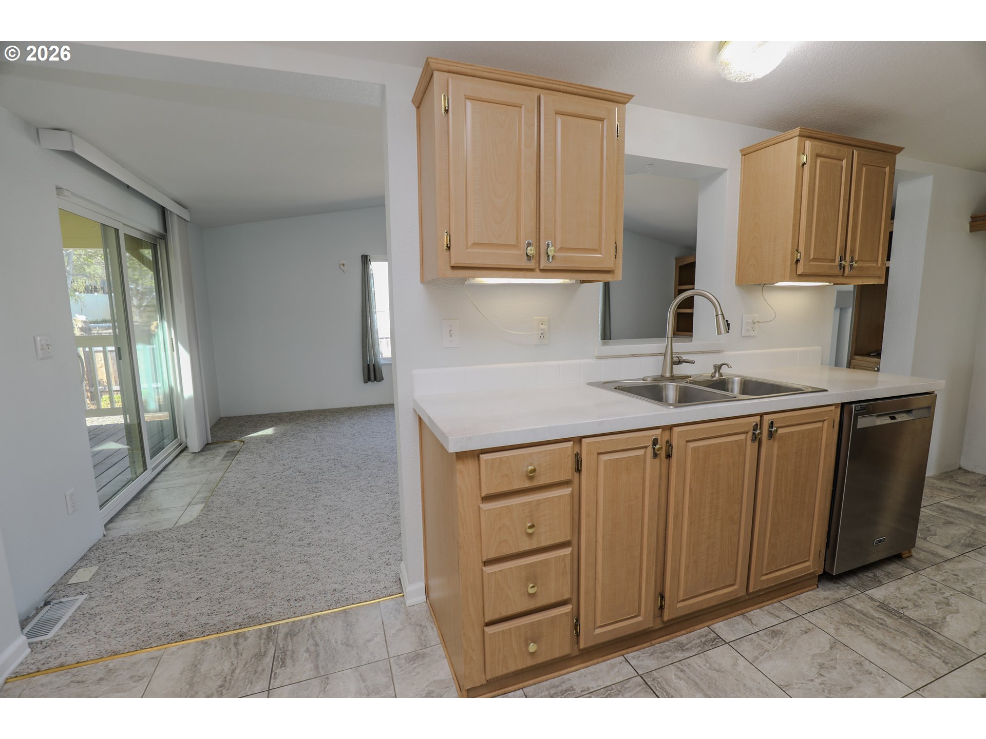 210 Northwest Timothy Avenue Winston, OR 97496 - Photo 12 of 48 a kitchen with granite countertop a sink cabinets stainless steel appliances and a window