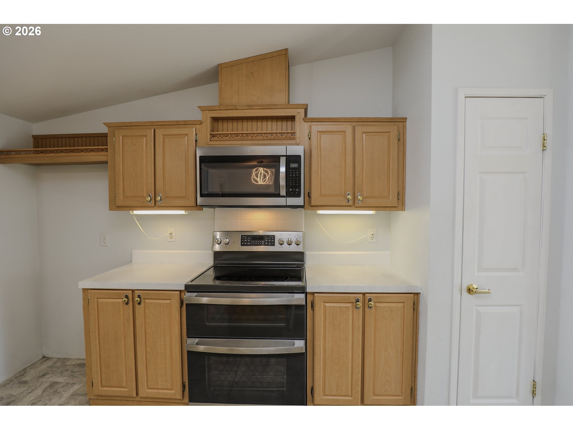 210 Northwest Timothy Avenue Winston, OR 97496 - Photo 14 of 48 a kitchen with a stove and a microwave